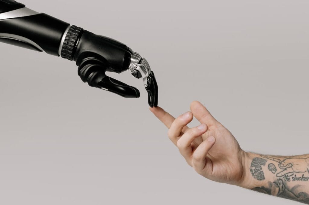 Sell Business A robotic hand reaching out to a man's hand, available to buy. Exit Advisor Business Broker