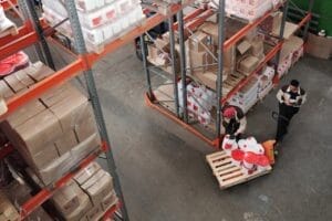 Sell Business A warehouse filled with boxes and pallets is essential for a Wholesale Business. Exit Advisor Business Broker