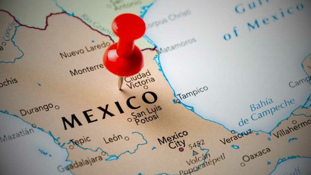 Mexico's Real Estate Market Trends for Foreign Investors - Sell Business Red pushpin on a map emphasizing Mexico Real Estate, with visible city names and borders. Exit Advisor Business Broker